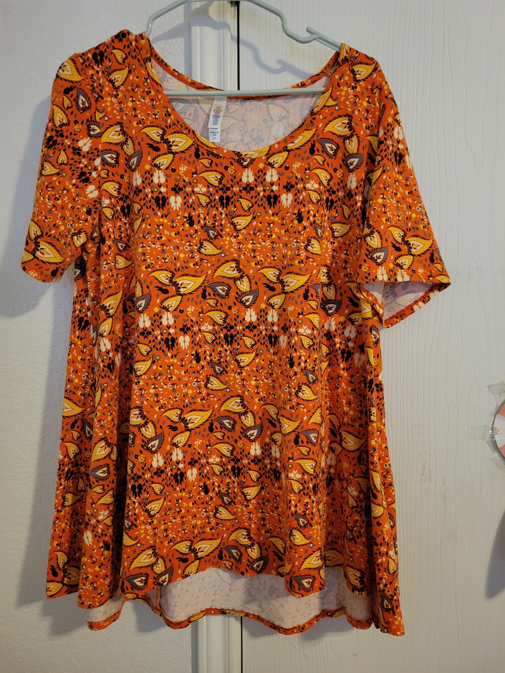LuLaRoe Orange Floral Swing Top